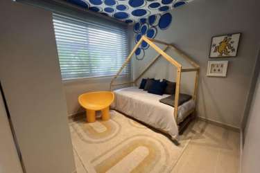 Elegant modern bedroom with natural light Imaterra Panama Pacifico house for sale