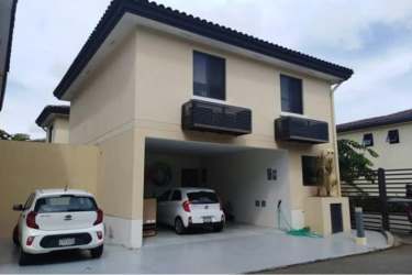 Suburban house exterior with double garage and driveway in PH River Valley Panama Pacifico