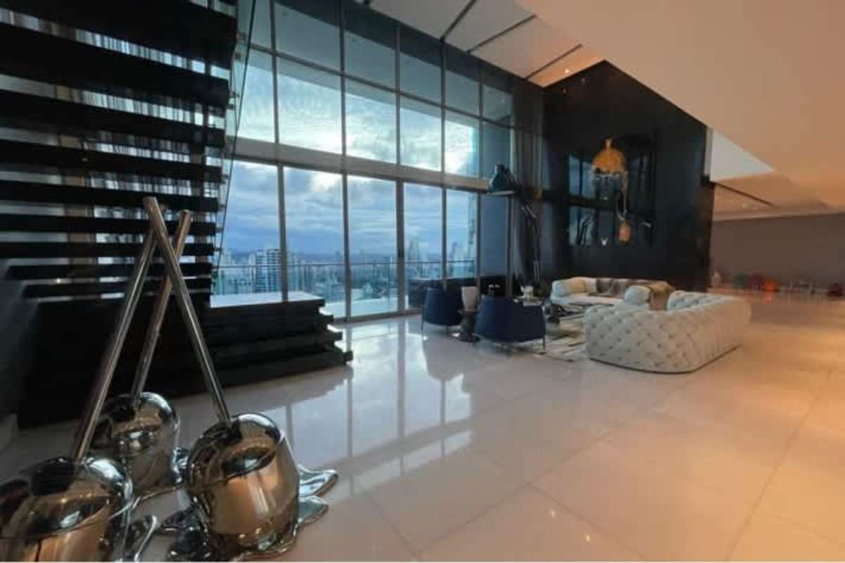 Modern living space with double-height ceiling, panoramic ocean view, and upscale furnishings at PH Aqualina Punta Pacífica