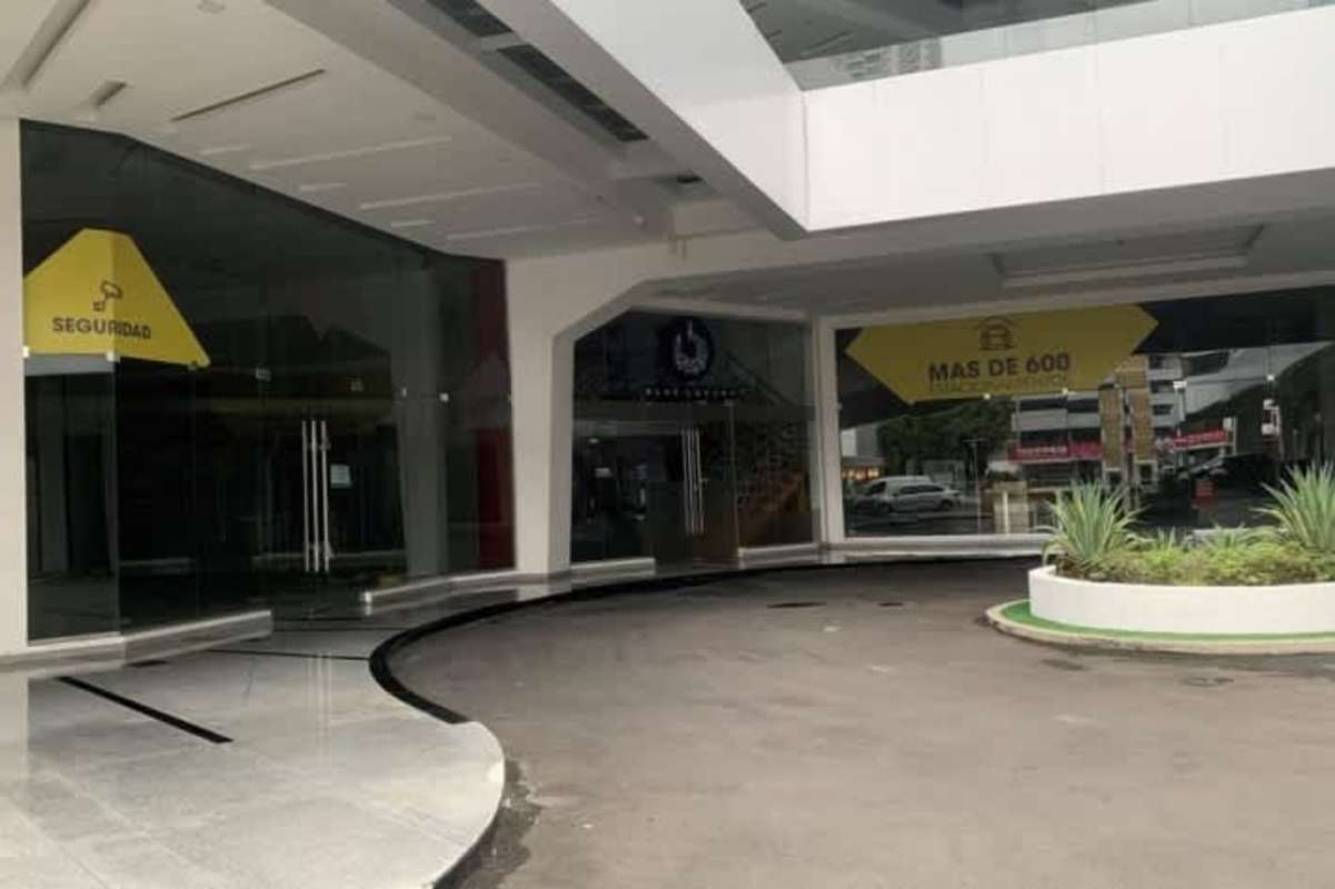 Covered circular driveway and entrance to glass commercial complex Via Brasil Obarrio Panama