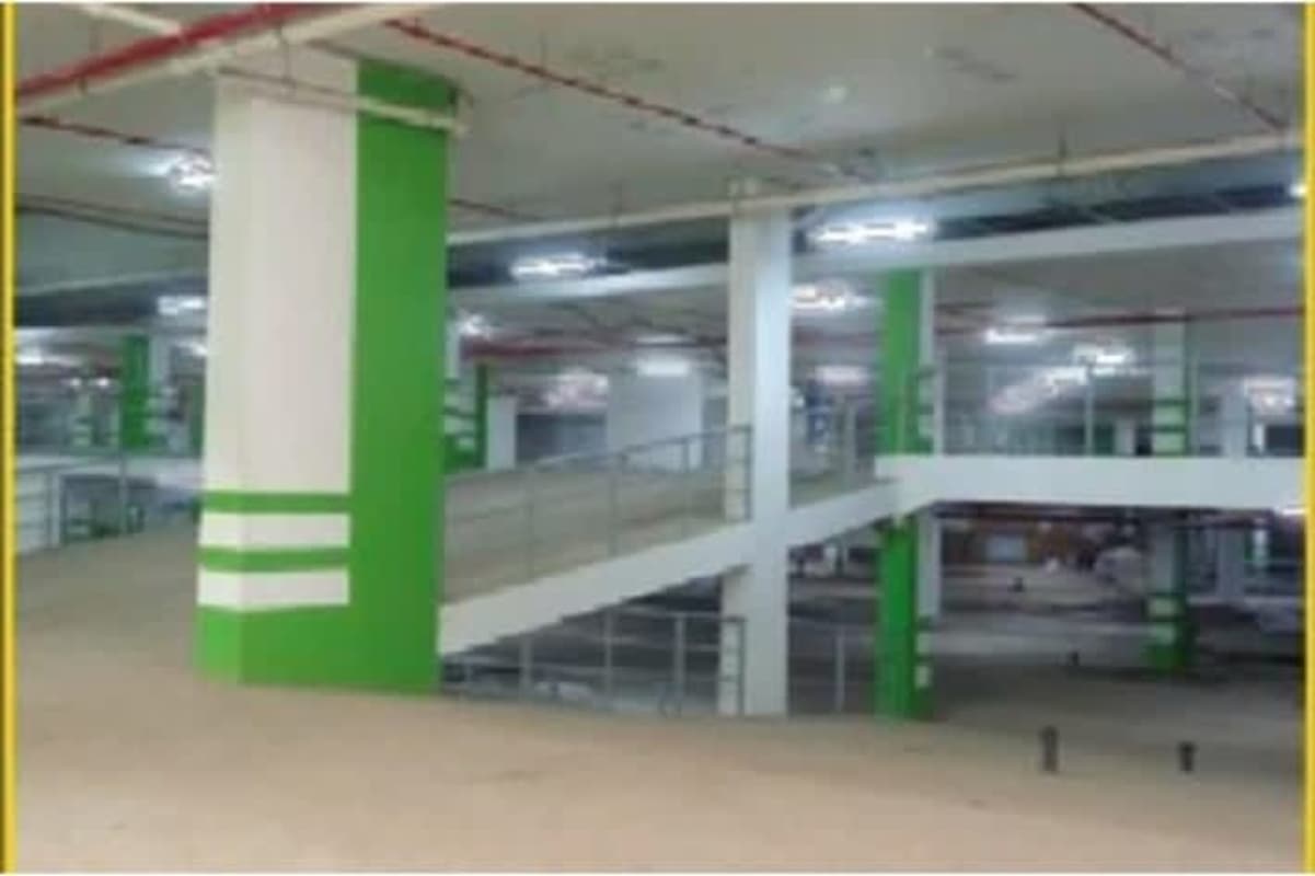 Bright indoor parking garage with ramps, columns, striping Obarrio Panama City