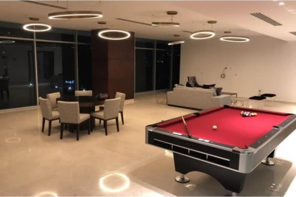 Modern entertainment lounge with pool table, large windows city view PH The Palace Bella Vista Panama