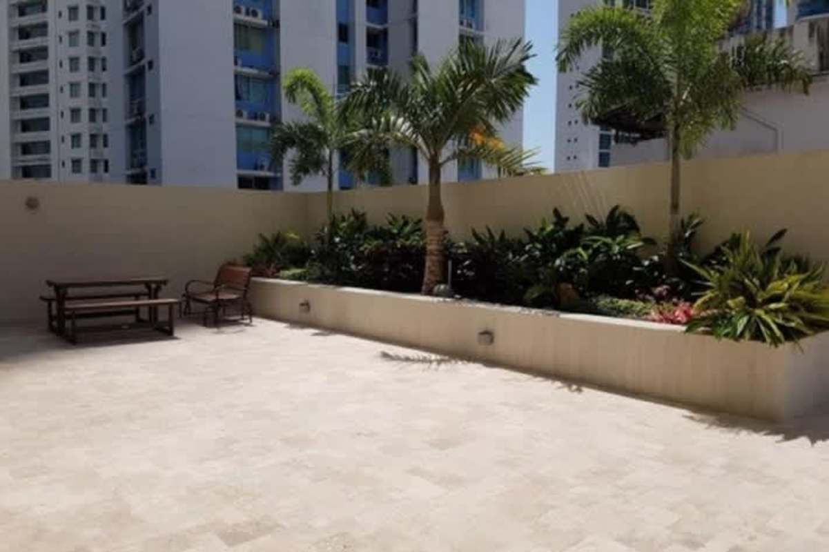 Outdoor patio area with landscaping and seating at PH The Palace Bella Vista Panama
