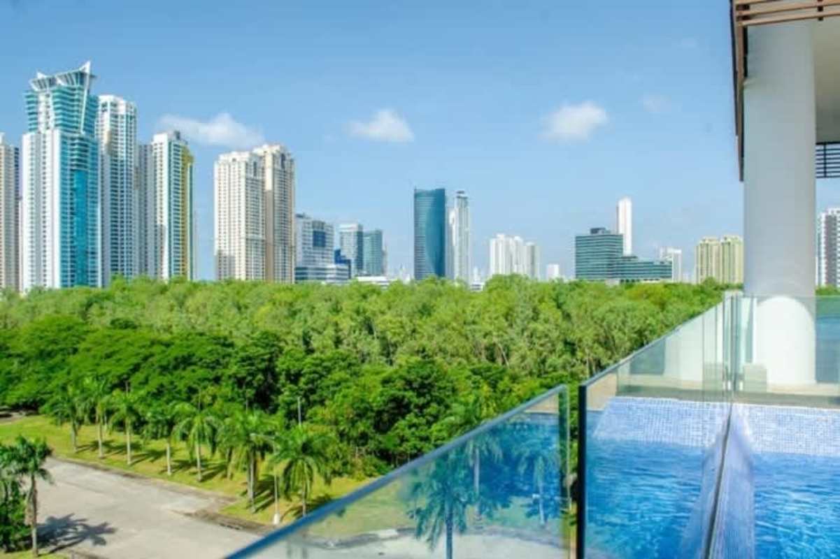 Modern dining area adjacent to Italian style kitchen in luxury PH Park Lane apartment Costa del Este Panama