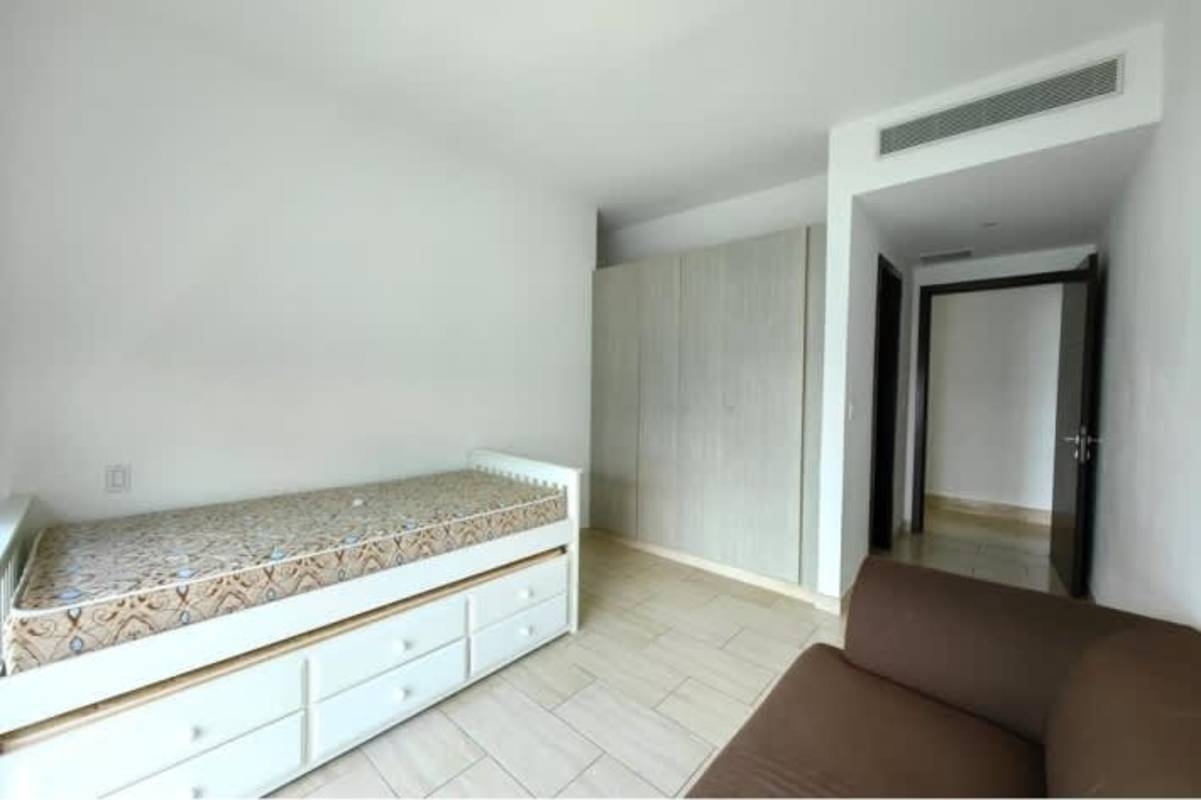 Luxury balcony with glass railing overlooking Pacific Ocean and Panama City skyline at Grand Tower Punta Pacifica Panama