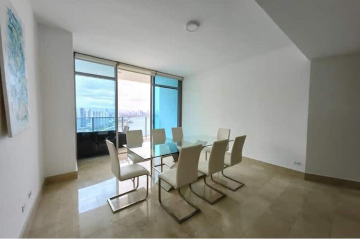 Modern bedroom with large windows and ocean view in Grand Tower luxury apartment Panama City