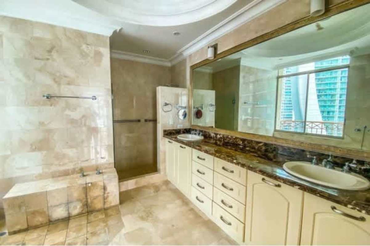 Luxury kitchen with island, granite countertops, wood cabinetry in Pacific Point Tower 600 Punta Pacifica Panama