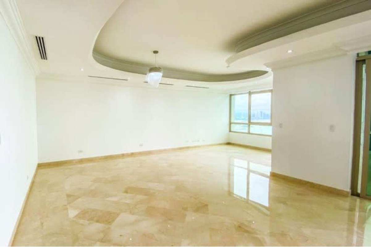 Master bedroom with large windows, marble floors, ocean and city views in Punta Pacifica Panama