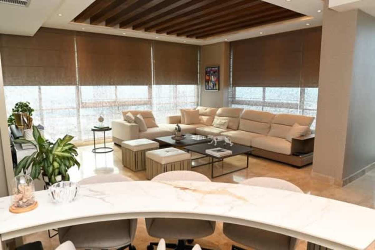 Spacious master bedroom with floor-to-ceiling ocean view windows at PH Titanium Costa del Este penthouse