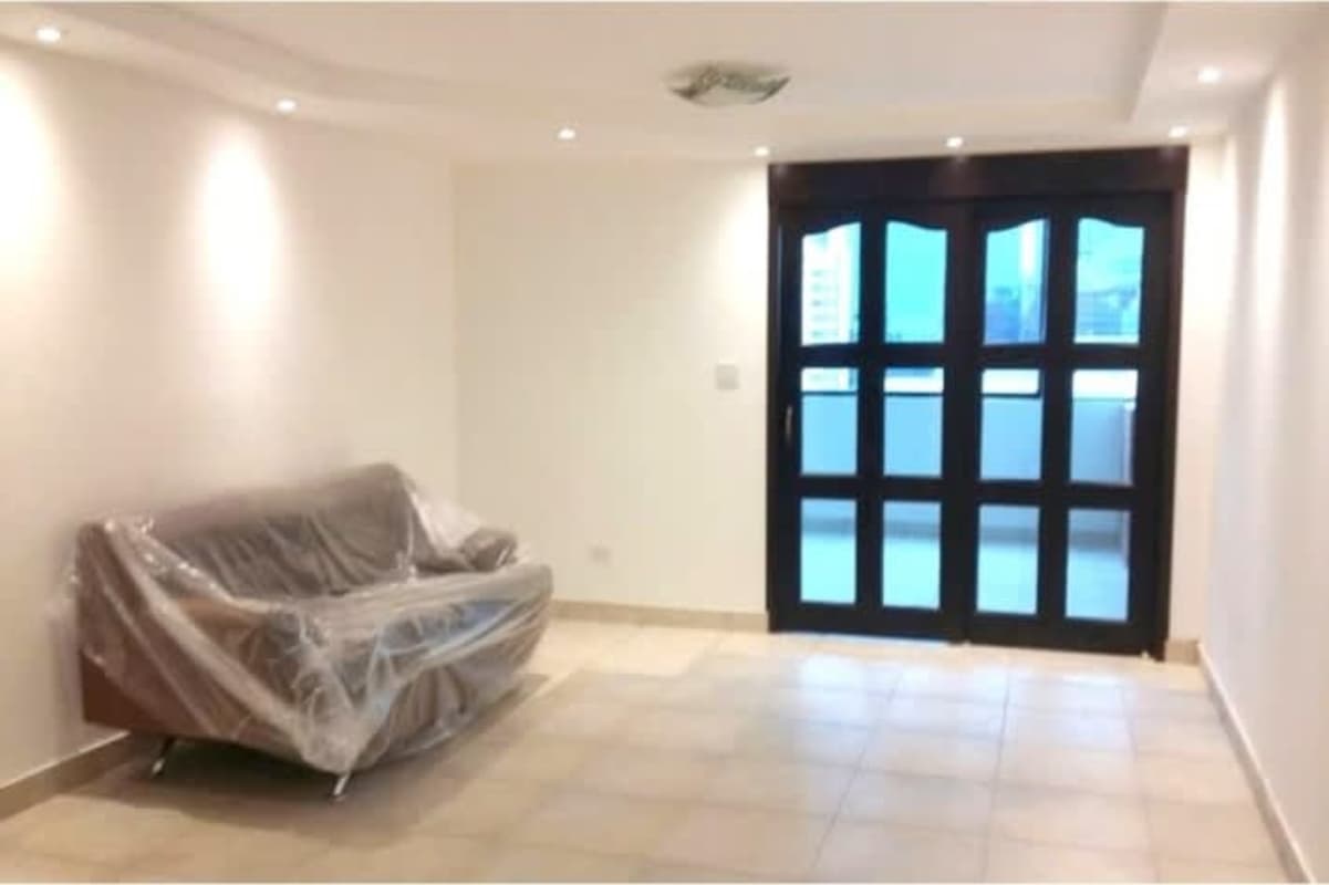 Enclosed kitchen with white cabinets stove oven in Obarrio apartment rental Panama City