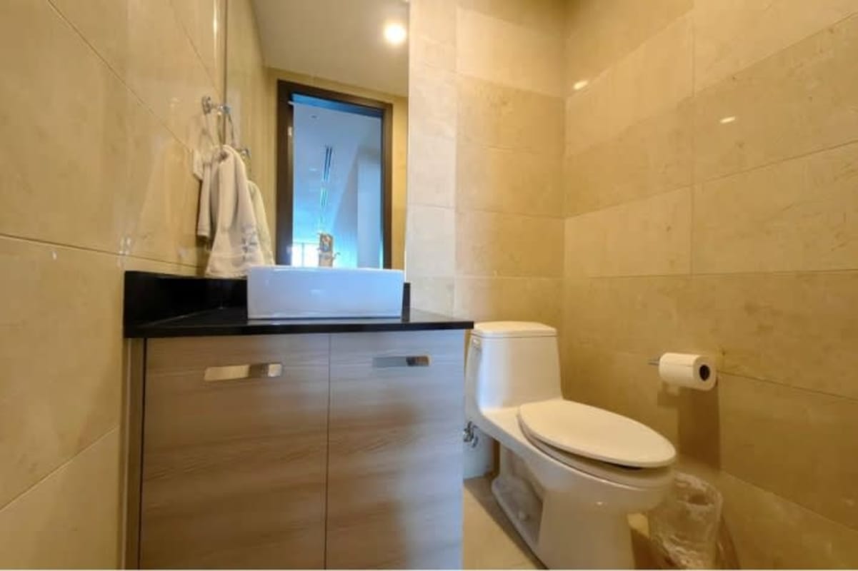 Semi-open modern kitchen with granite counters and premium appliances Grand Tower Pointe Pacifica Panama