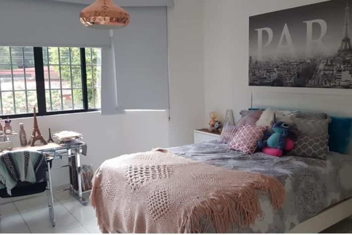 Bedroom with Paris decor, copper light and window in La Alameda Betania Panama