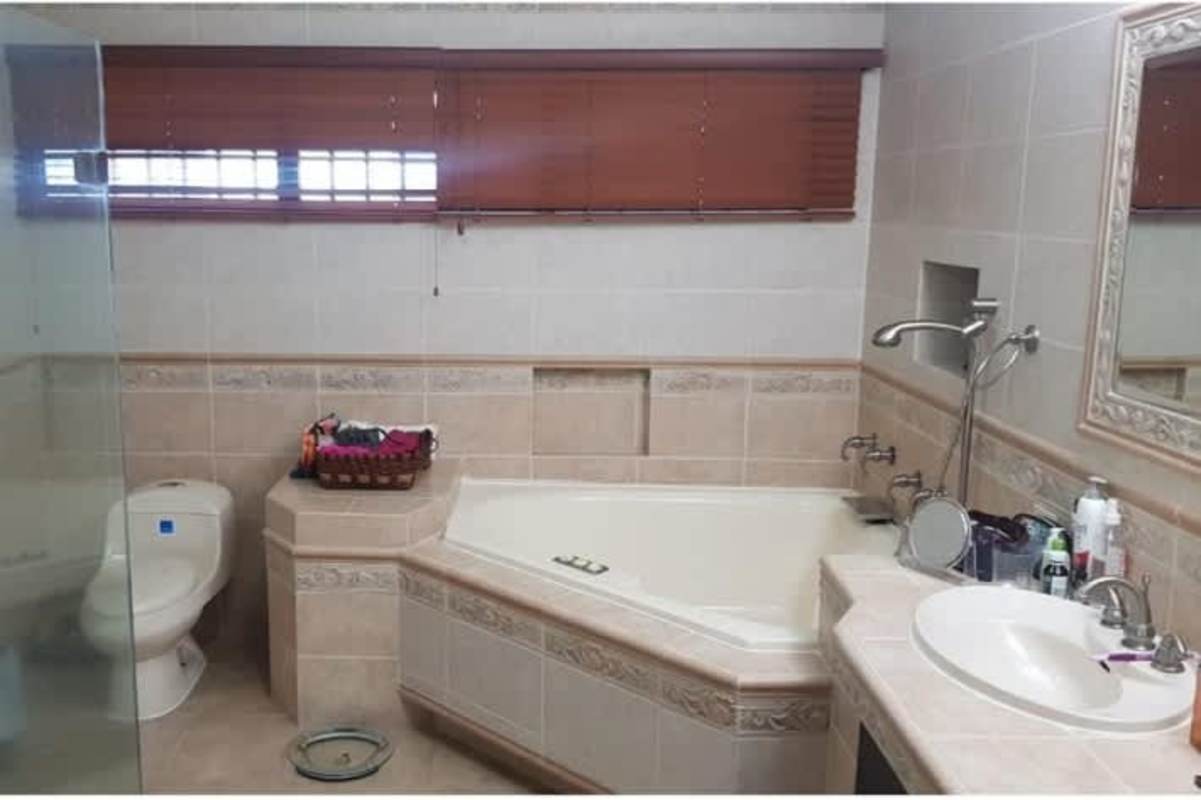 Modern bedroom with personalized decor and large window La Alameda Betania