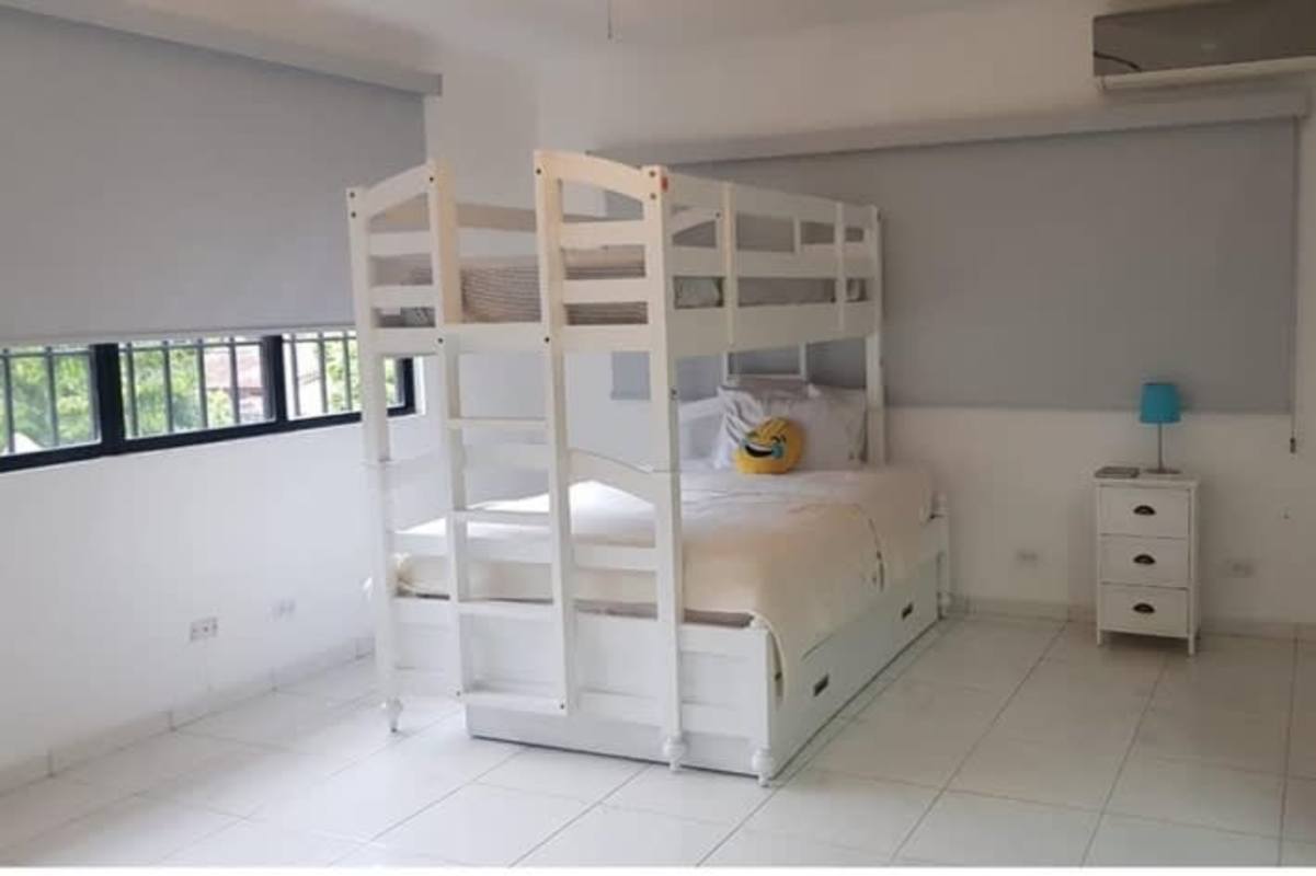 Bright minimalist bedroom with bunk bed in La Alameda Betania Panama