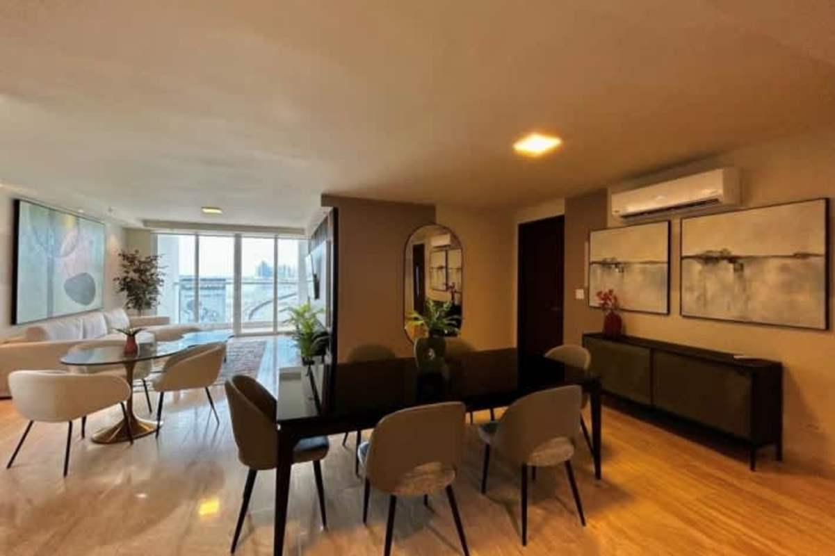 Elegant dining area with marble flooring and ocean backdrop in The Regent
