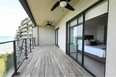 Spacious balcony with glass railing, ocean view at Solaris apartment Punta Caelo Panama