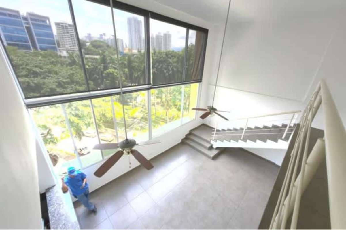 Bedroom with large window, AC and walk-in closet in PH El Cangrejo Loft Panama City