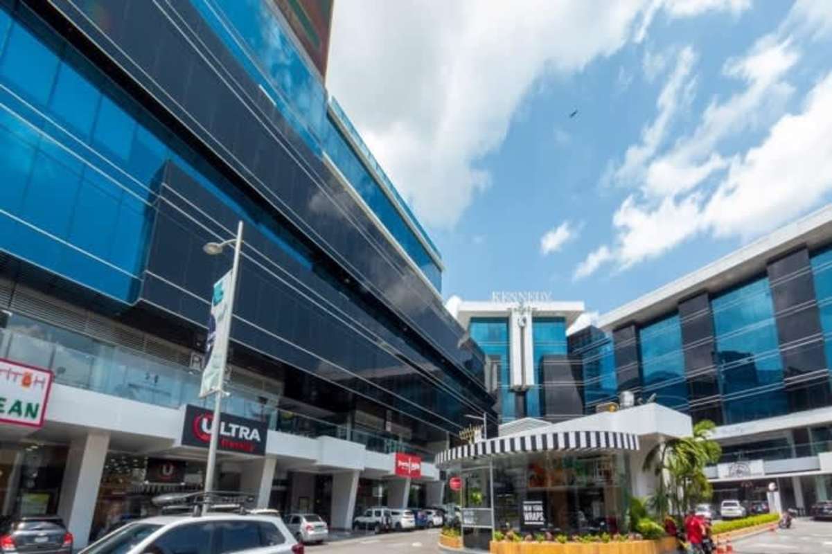 Retail frontage with modern glass facade and signage space at commercial plaza corner of Via Brasil and Via Israel Panama