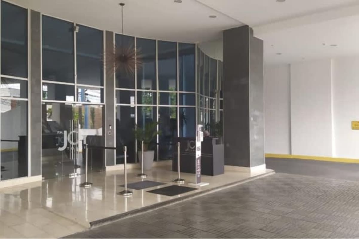 Modern tower lobby entrance with security access at PH Joy Tower in San Francisco Panama