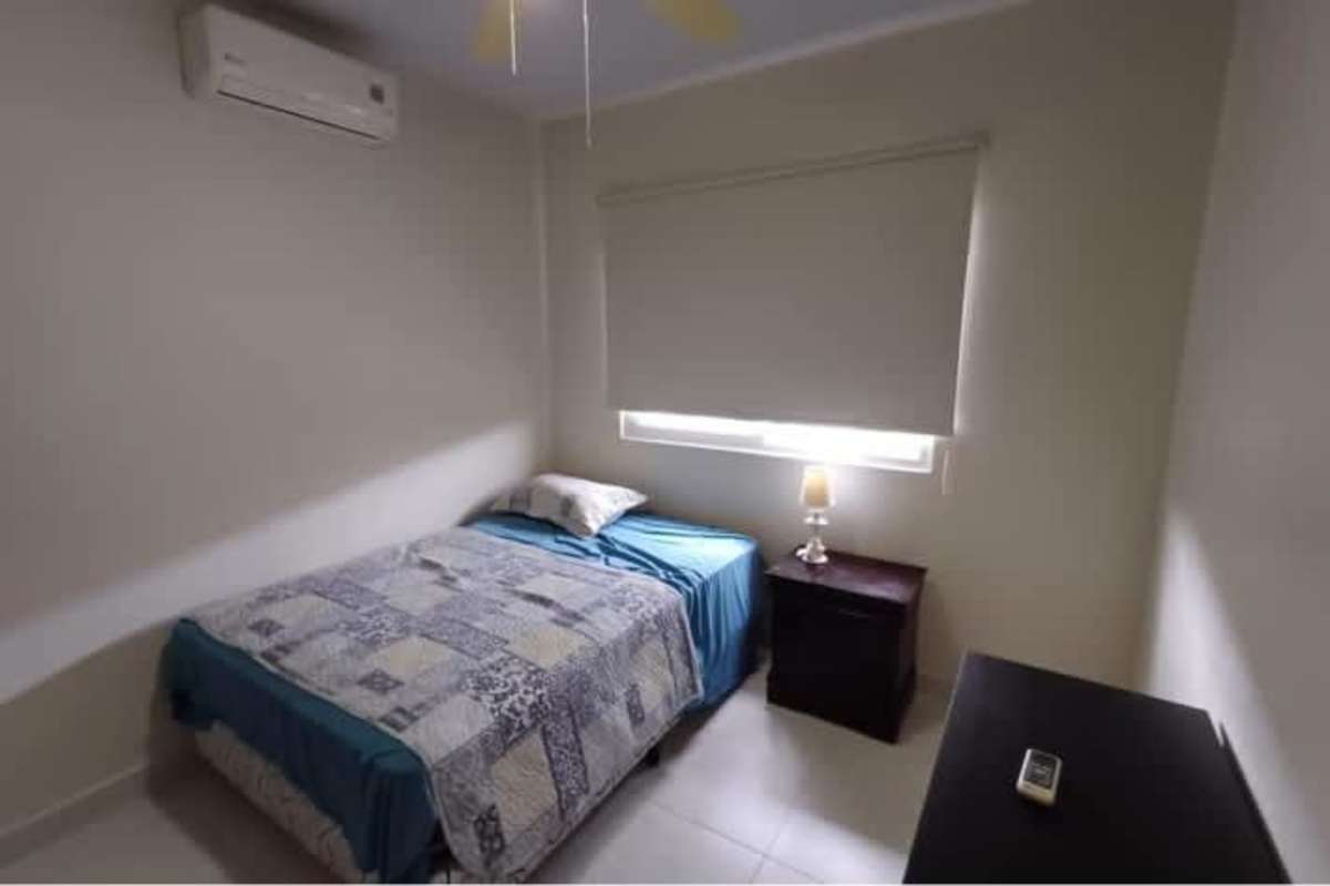 Bedroom with wardrobe, AC and tile floors at Residencial Versalles Panama