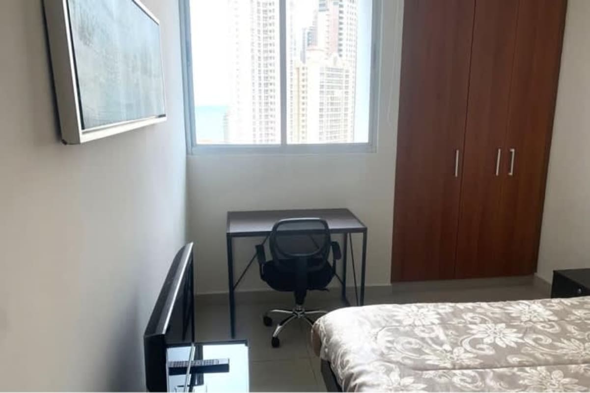 Spacious living dining area with balcony access city view PH Pacific Sea Panama