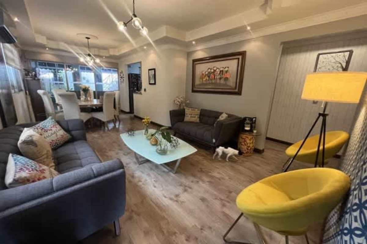 Kitchen with granite worktops, red backsplash, stainless appliances in Colinas del Golf Brisas del Golf Panama