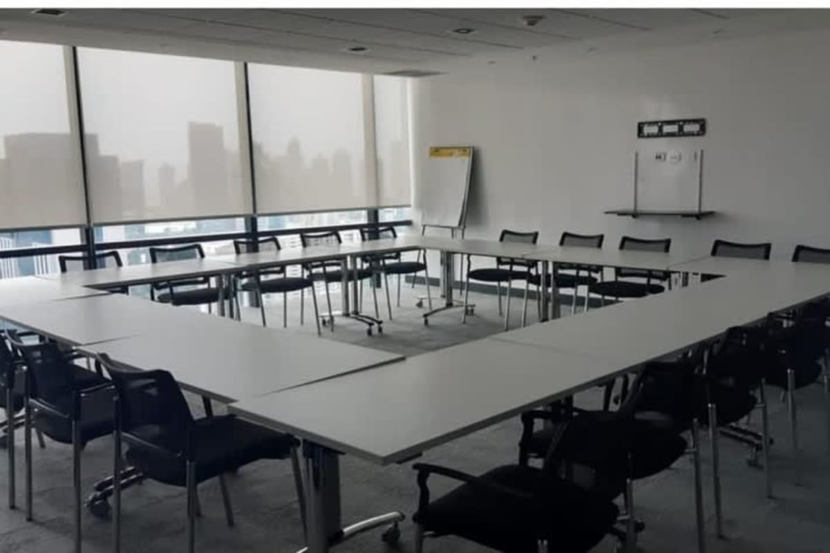 Office corridor with sunset mural, glass partitions in Tower Bank Panama City