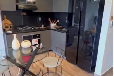 Cozy bedroom with large window, wall art, neutral decor apartment for rent Panama Pacifico