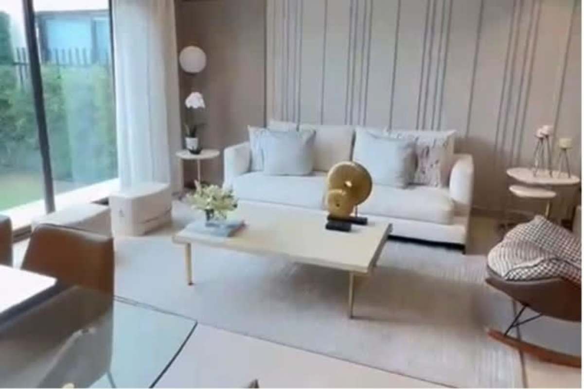 Open concept living dining room with garden access in house in Costa Sur Panama