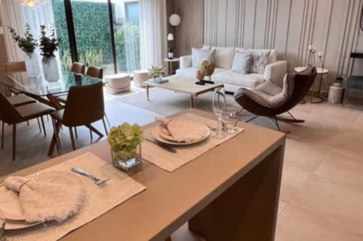 Modern open concept living dining space with garden view Costa Sur house Panama