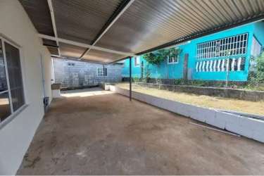Back patio area covered with garden La Chorrera Panama house for sale