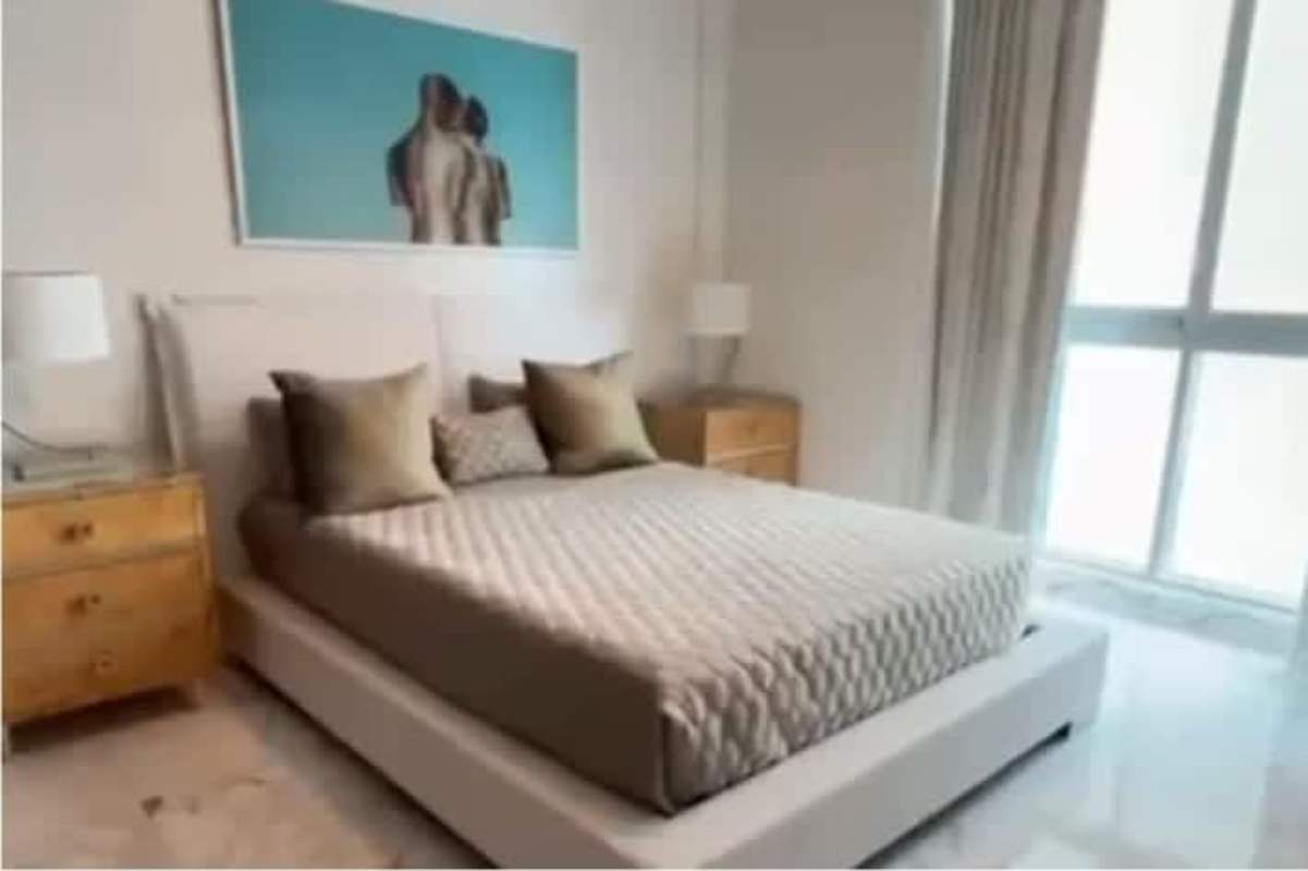 Elegant master bedroom private oceanfront view floor-to-ceiling windows PH Breeze Costa del Este Panama City