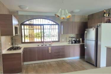 Bathroom with double sink vanity modern tile and mirrors in house for sale Valle Village Espino San Carlos Panama