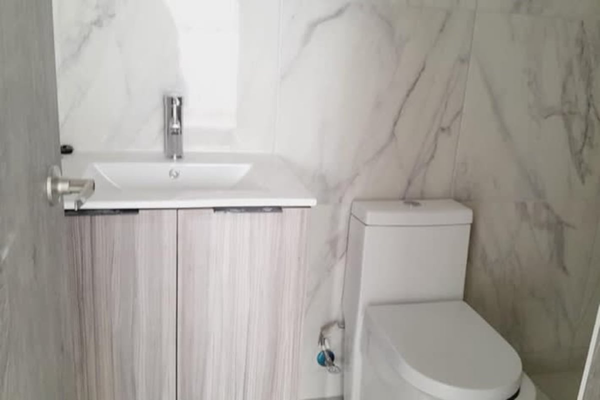 Modern bedroom large windows city skyline view PH The Gray Obarrio Panama