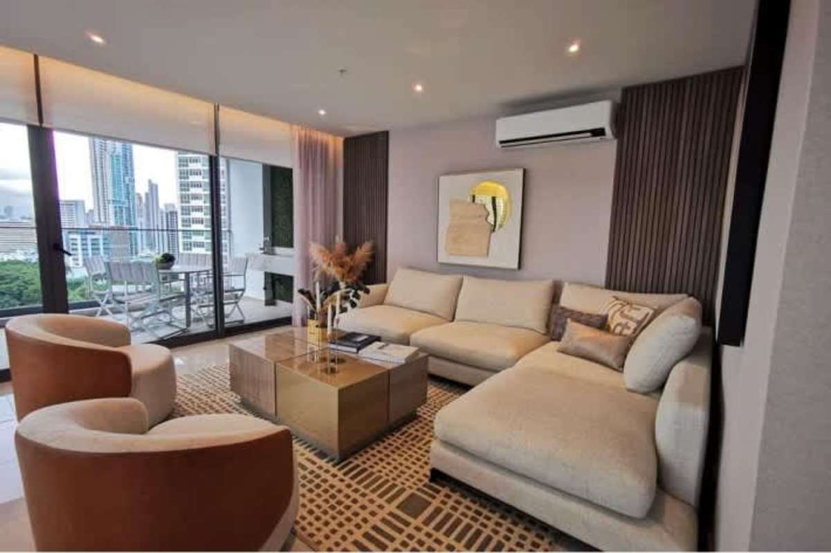 Modern dining space with floor-to-ceiling windows and skyline views at Prestige Tower