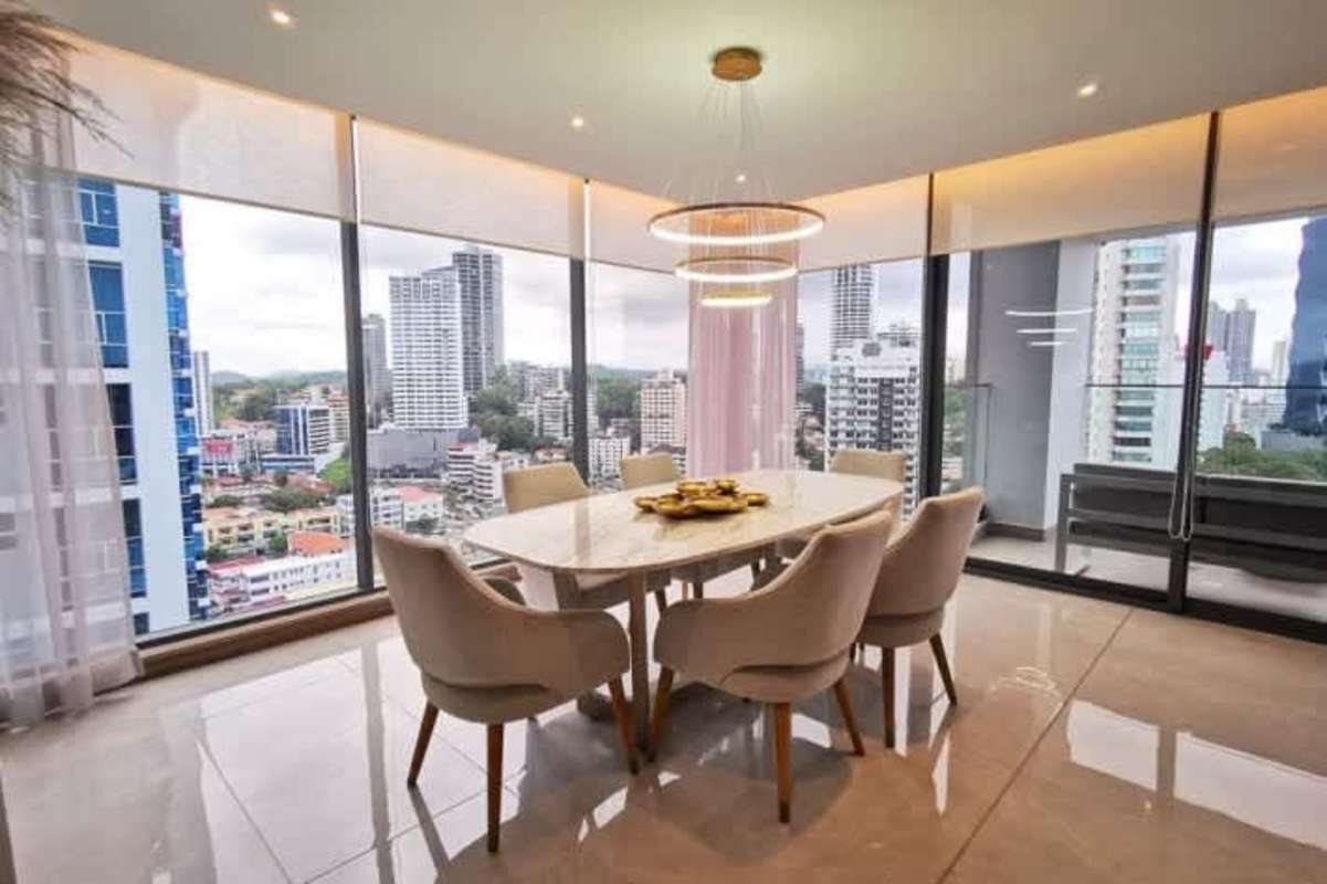 Modern balcony with seating area and panoramic city views in Prestige Tower Bella Vista
