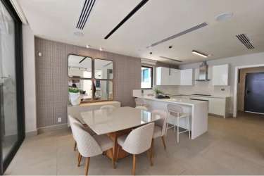 Bright living room connecting to terrace with garden view in Explora Panama Pacifico