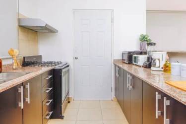 Modern kitchen with granite counters stainless appliances Coronado beach house