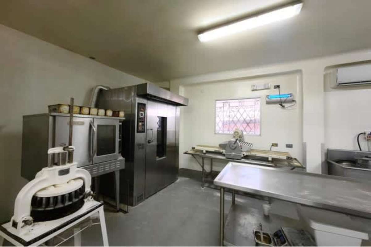 Dining area or meeting room with bright natural light, large windows, eclectic design inside commercial property San Francisco Panama