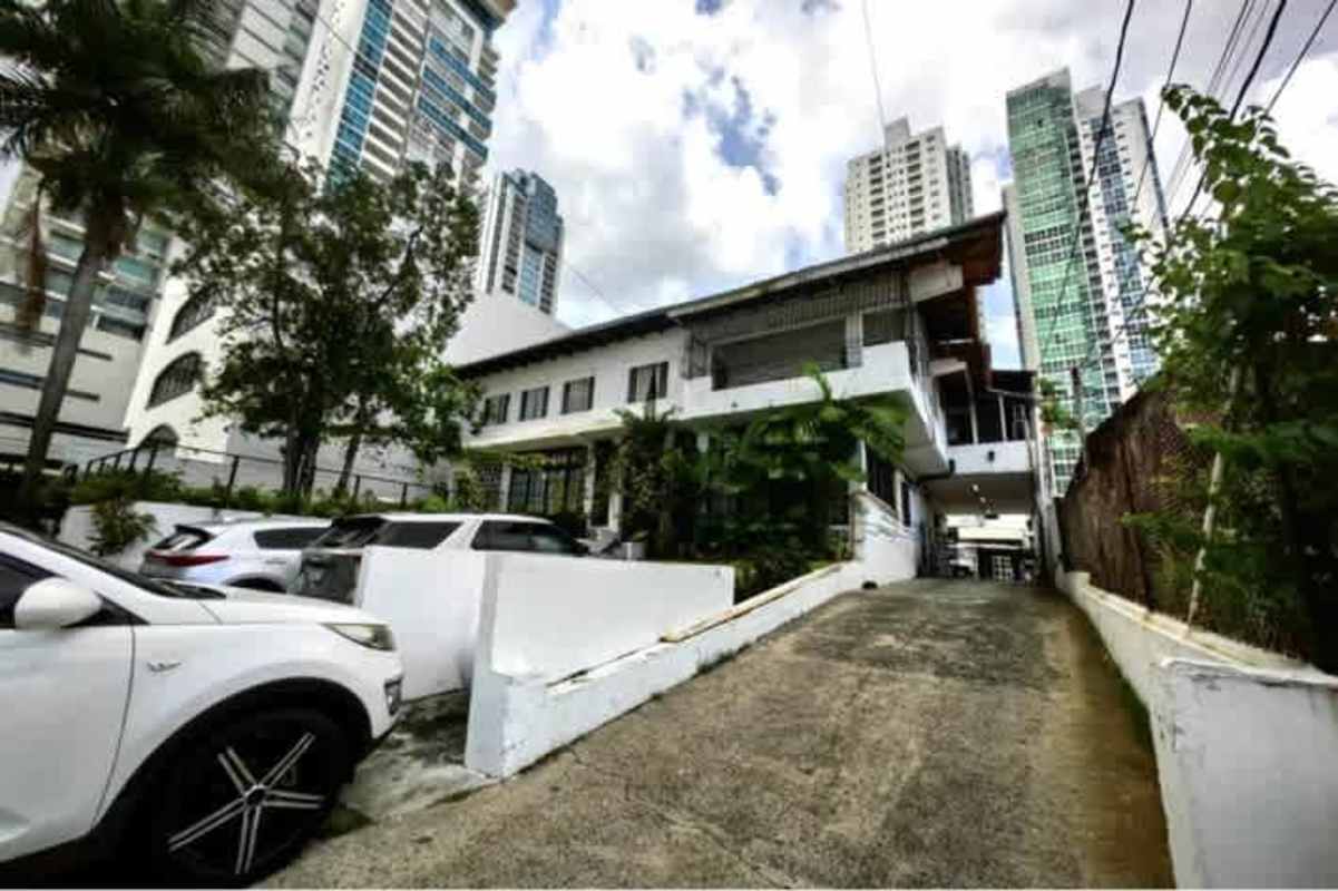 Outdoor terrace with mature trees, stone accents, garden elements and patio in commercial property Panama City