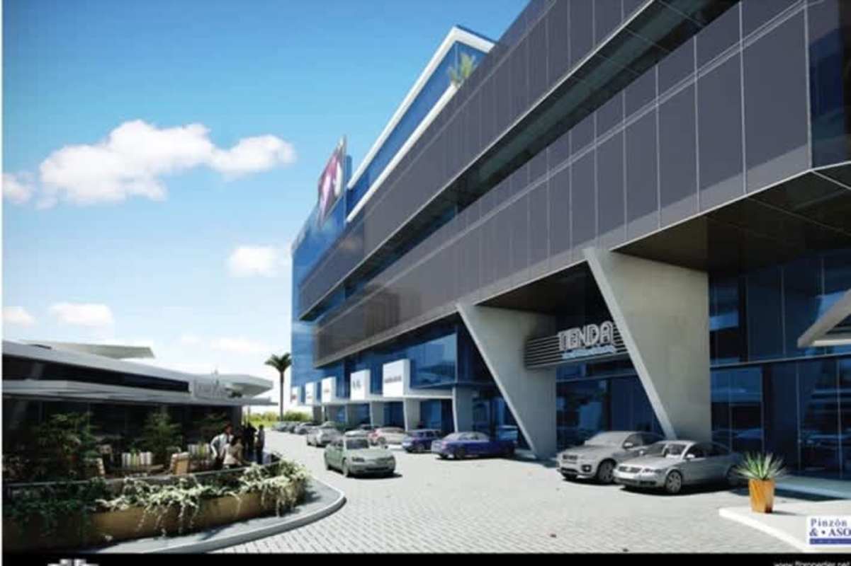 Modern commercial plaza with glass facade, parking and retail spaces in Obarrio Panama