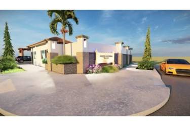Secure community entrance Santa Catalina Villas Veraguas Panama with Mediterranean architecture