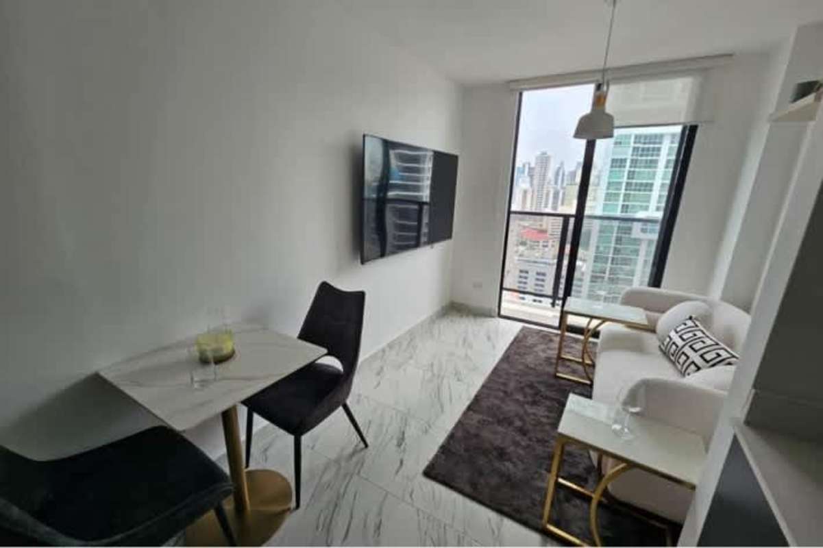 Living dining open concept with marble floors and large window city view The Gray Obarrio Panama