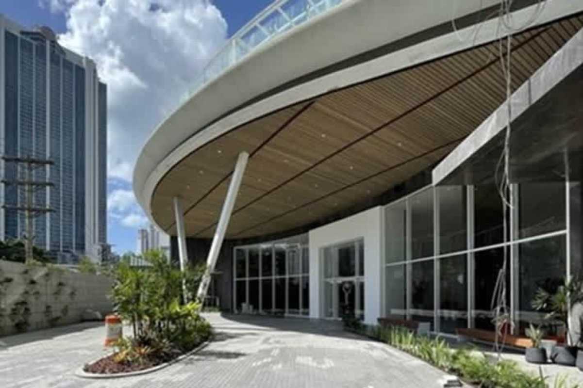 Ultra-modern tower facade with glass walls and contemporary architecture at PH Marbella Tower Panama City