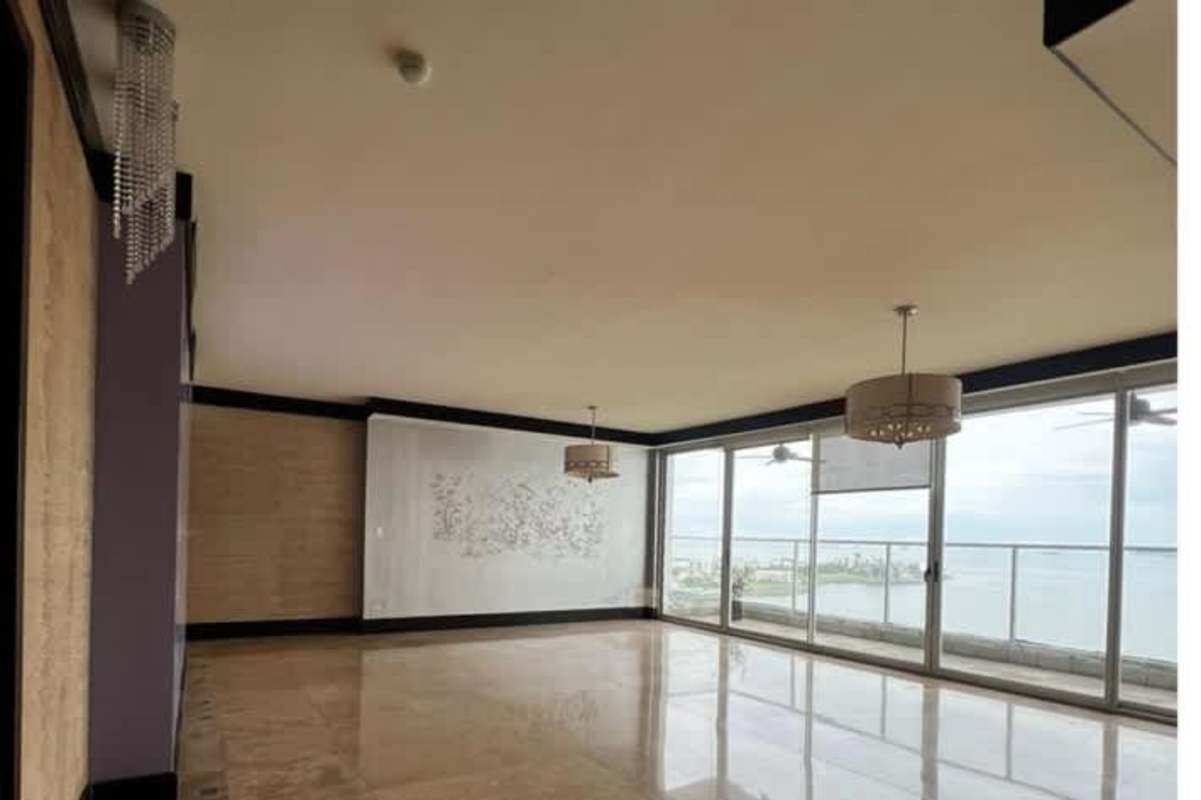 Modern kitchen with granite countertops and large window in Punta Pacífica Panama