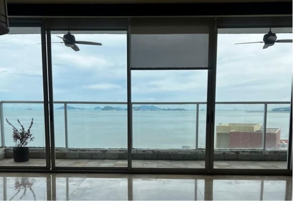 Living dining with sliding doors to balcony and sea view Punta Pacífica Panama