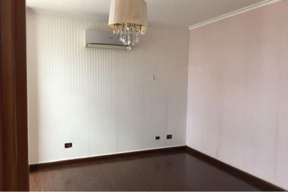 Bright living dining room with wood floors and access to balcony in PH San Francisco Panama City