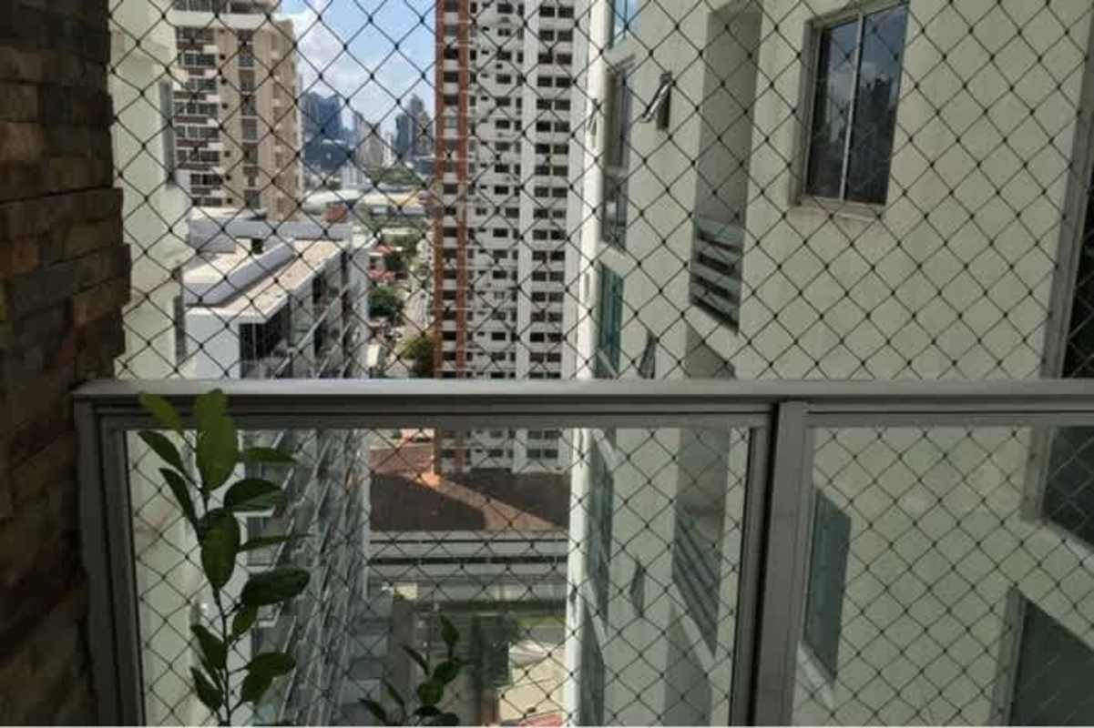 Contemporary kitchen with white cabinets, gas stove, oven, and range hood in PH San Francisco
