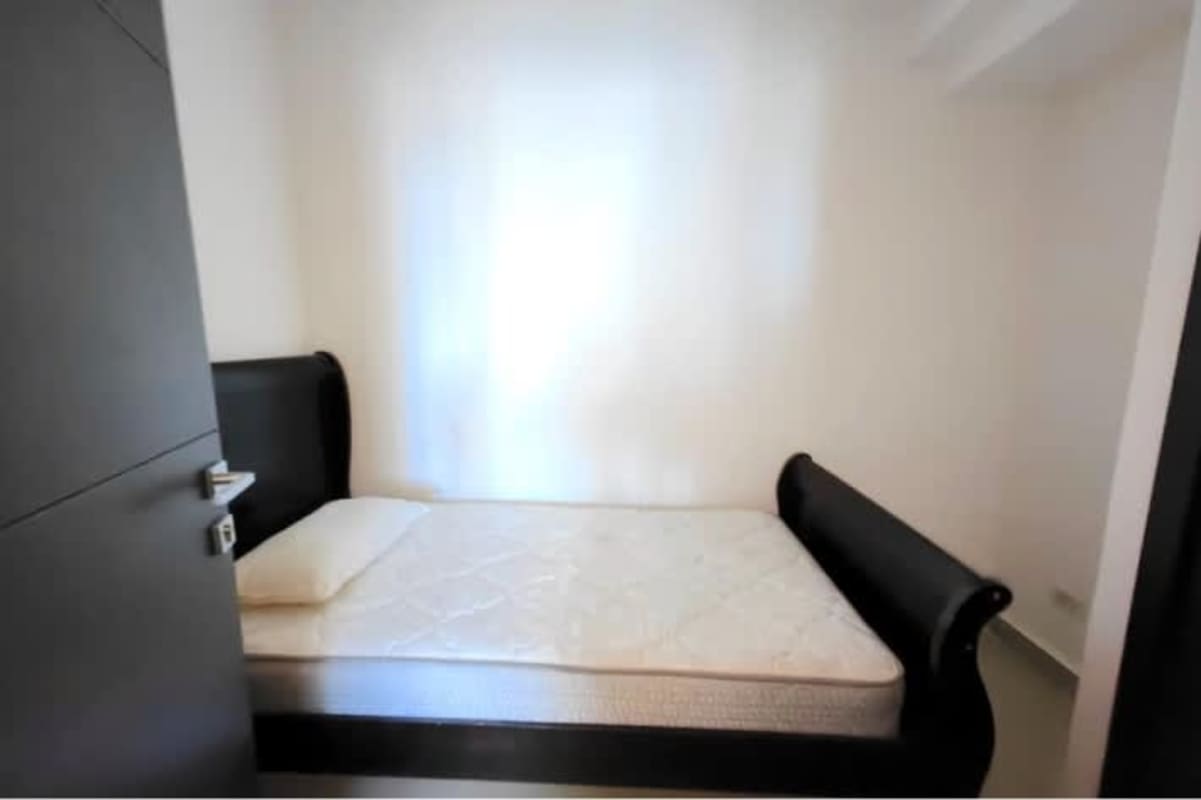 Bright master bedroom with panoramic ocean and skyline views in Grand Tower Punta Pacífica Panama