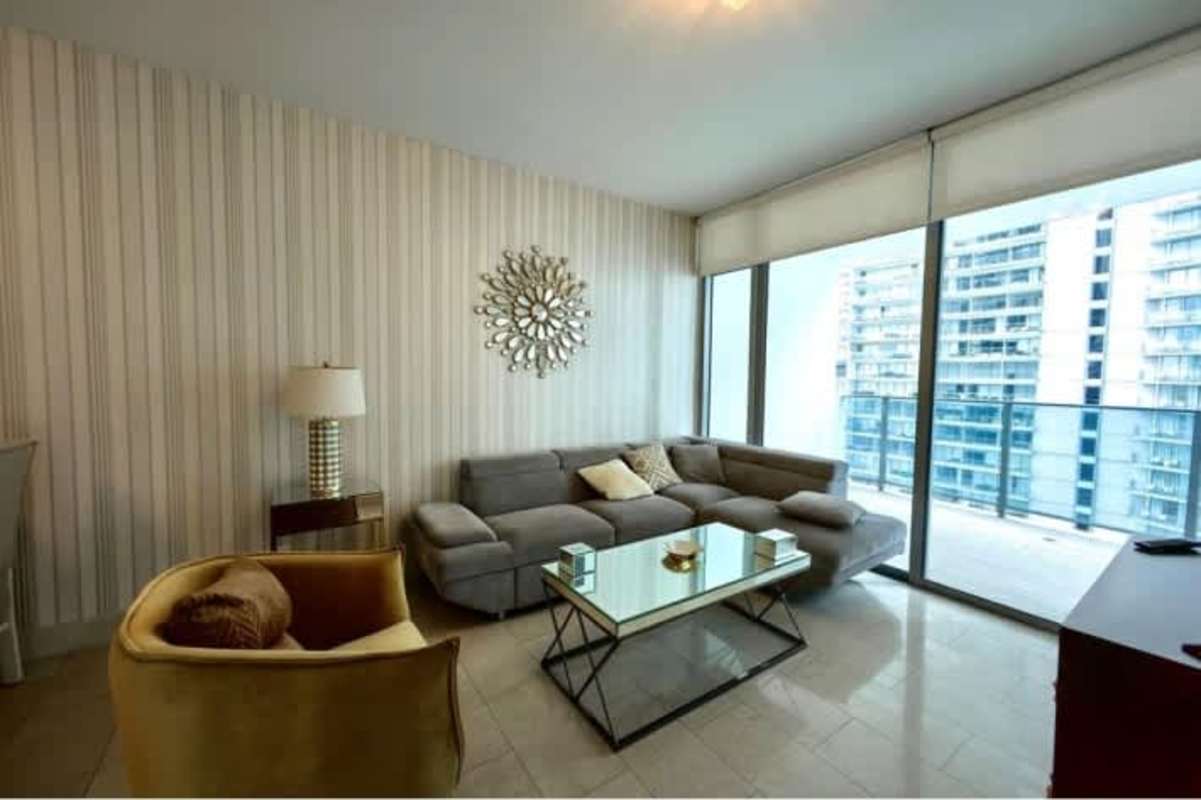 Master suite with walk-in closet, private bathroom, and panoramic city and ocean views at Grand Tower Panama